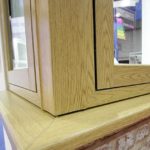 Flush sash window with woodgrain foil finish